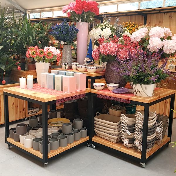 table with two wood shelves on wheels